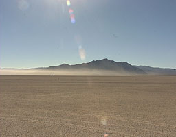 Dust hangs over the desert after the first run of today