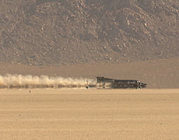ThrustSSC passes with parachute trailing