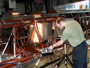 Robert Atkinson checks a bond on the car