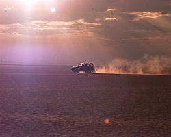 Racing clear of the desert at sunset