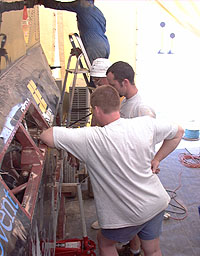 Nick Dove, Robbie Kraike and Glynne Bowsher check the rear suspension
