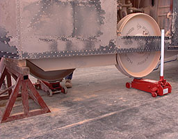 The rear wheels supported by jacks while the problem is investigated