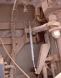 The bent ride height sensor on the leading rear wheel