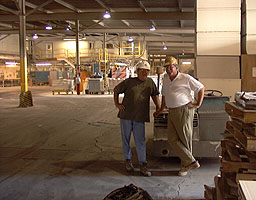 Plant Manager Ken Samuelson checks with one of his employees