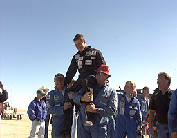 Andy Green hoisted into the air by the Team