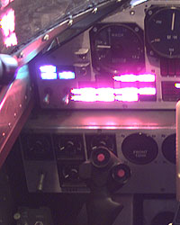 Close-up pictures of the OIL/AC VOLTS/F PRES captions and the hydraulic gauges