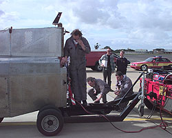 A Supacat provides electrical power to the car before a run at Farnborough